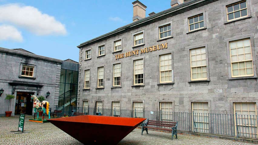 The Hunt museum with large red and black piece of artwork and painted ceramic horse in the foreground