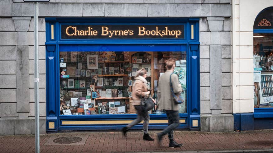 The exterior facade of Charle Byrne's Bookshop painted a dark blue with yellow wording.