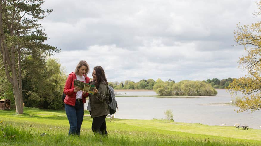 Two people exploring the grounds of Belvedere House, Westmeath