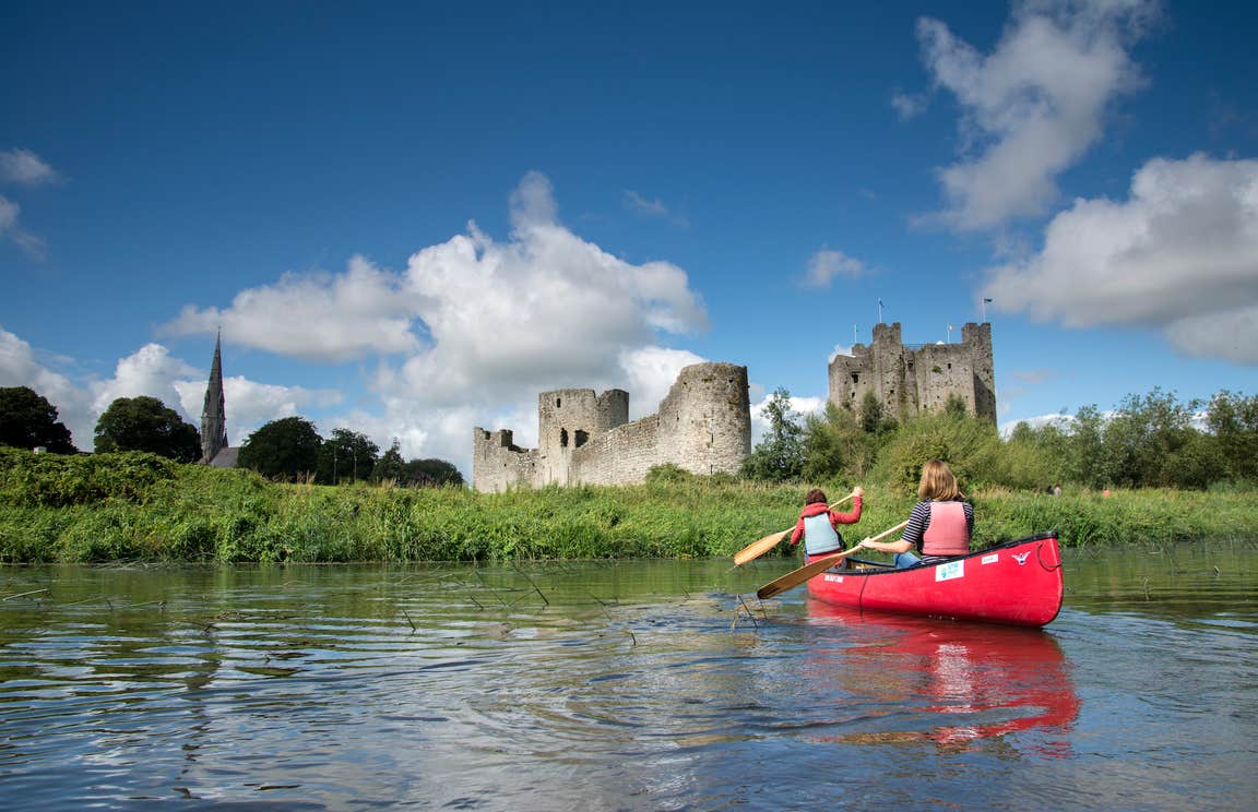 A boat paddling in a river outside Trim Castle in Meath