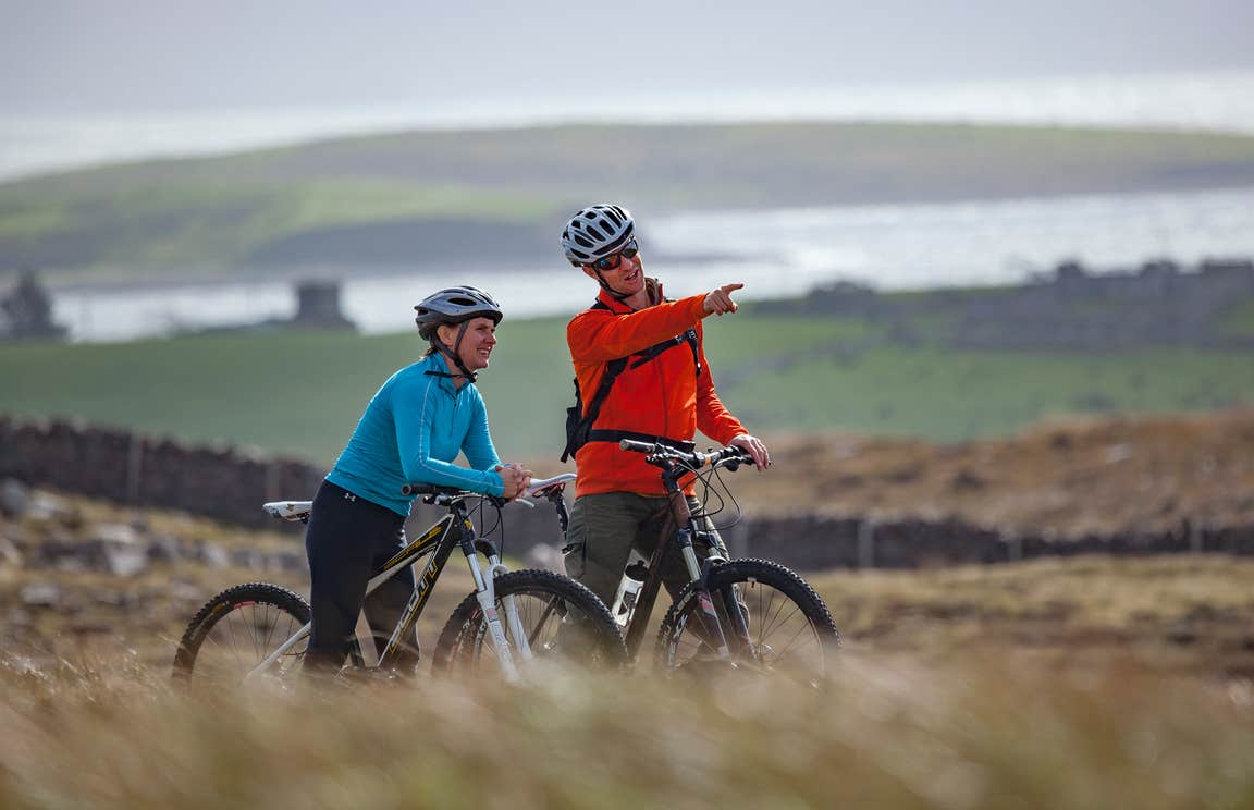 A couple cycling along the Great Western Greenway, Mayo