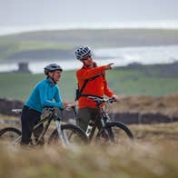 A couple cycling along the Great Western Greenway, Mayo