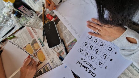 A person practicing calligraphy