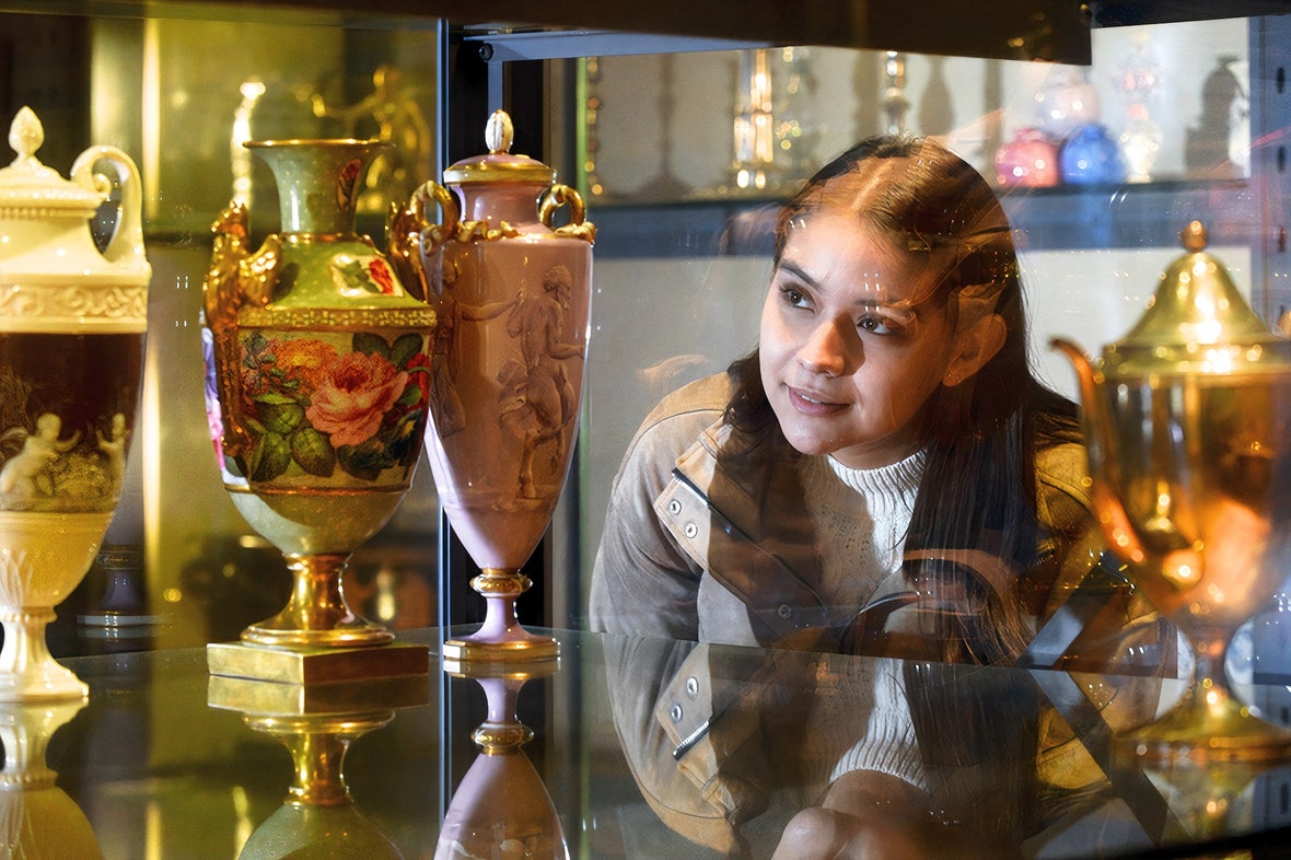 Woman looking at artefacts in the National Museum of Ireland – Decorative Arts and History in Dublin city