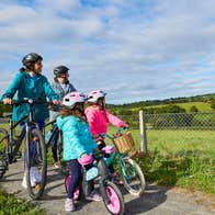 Family cycling the Waterford Greenway