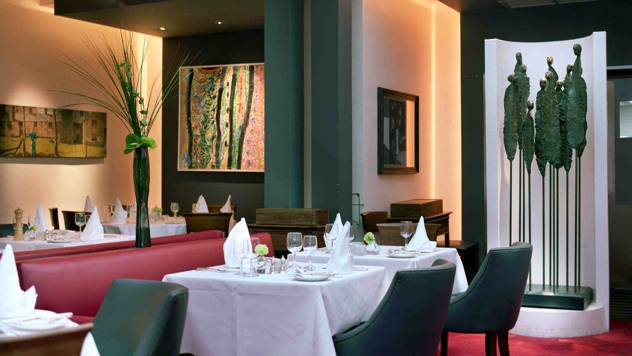 Restaurant dining room with a green sculpture