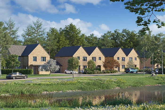 CGI of some houses, in a leafy tree filled environment, set before a small river.