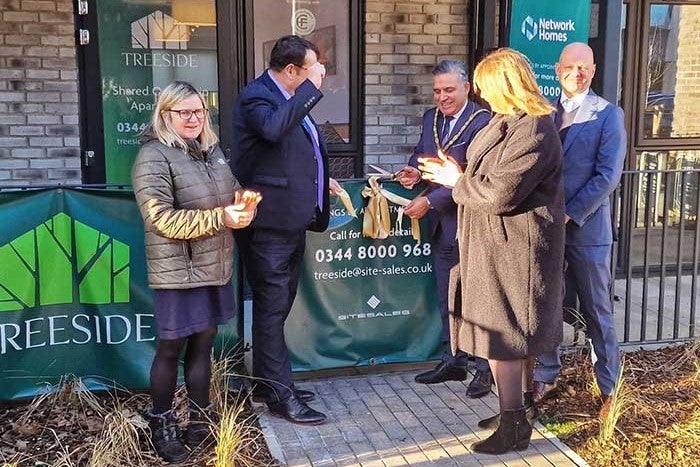 Senior staff from SNG. the Chair and Cabinet member from Epping Forest and Fairview New Homes cut ribbon.